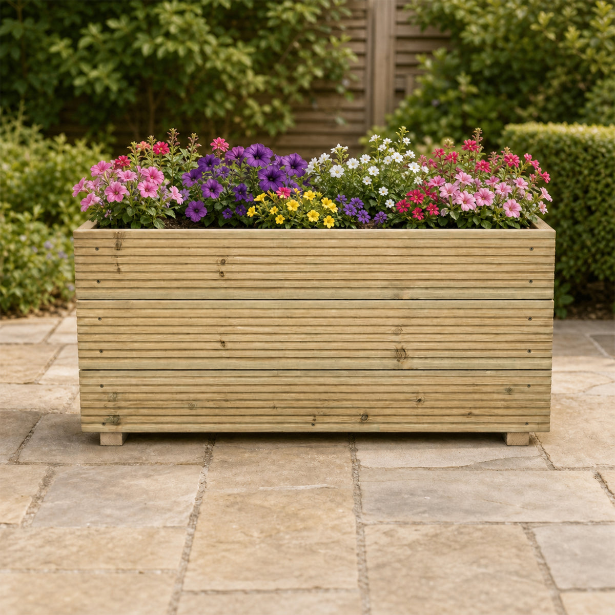 1 m Wooden Decking Planter – Triple – Board 100 × 35 × 48 cm planted with colourful flowers