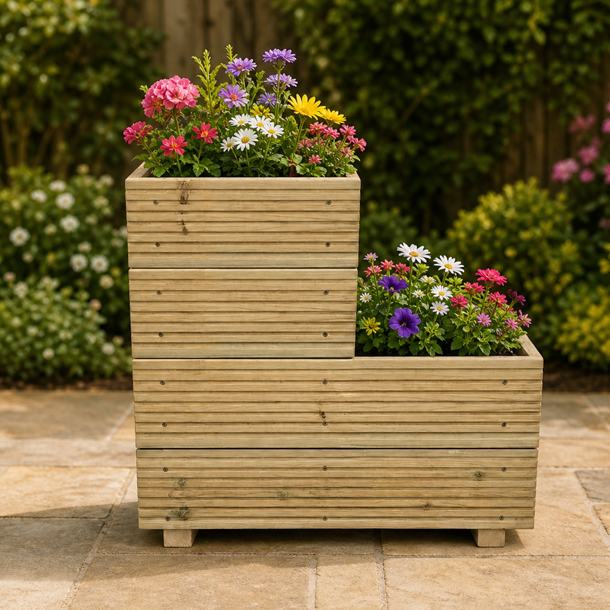 Two-tier wooden garden planter planted with colourful flowers