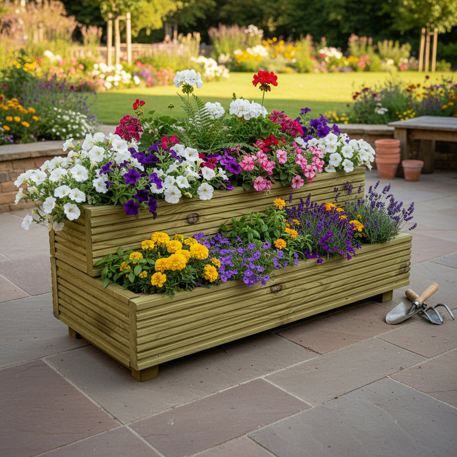 Two-tier wooden garden planter planted with colourful flowers