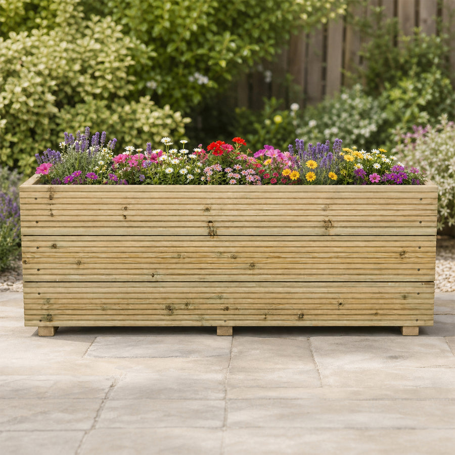 4 ft triple – board Wooden Decking Planter – 120 × 35 × 48 cm planted with colourful flowers