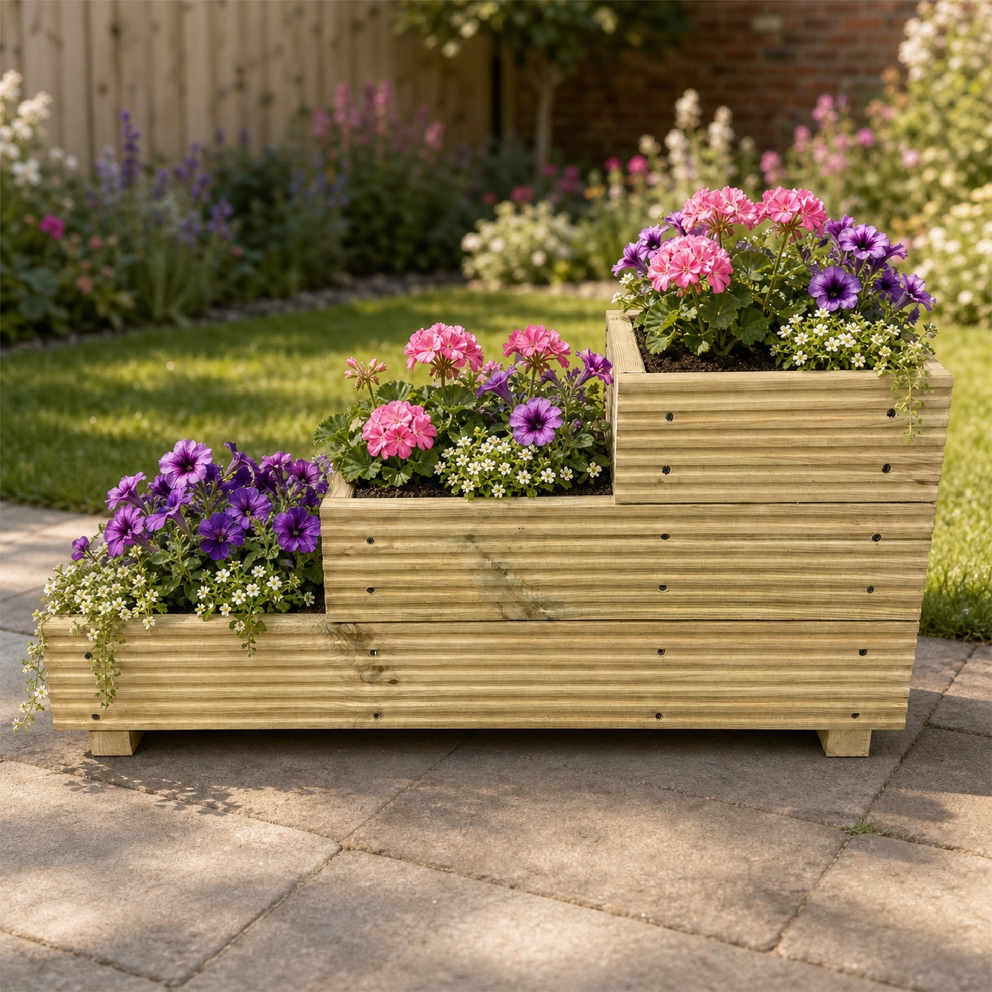 Three – Tier Wooden Decking Planter – 88 × 35 × 48 cm planted with colourful flowers