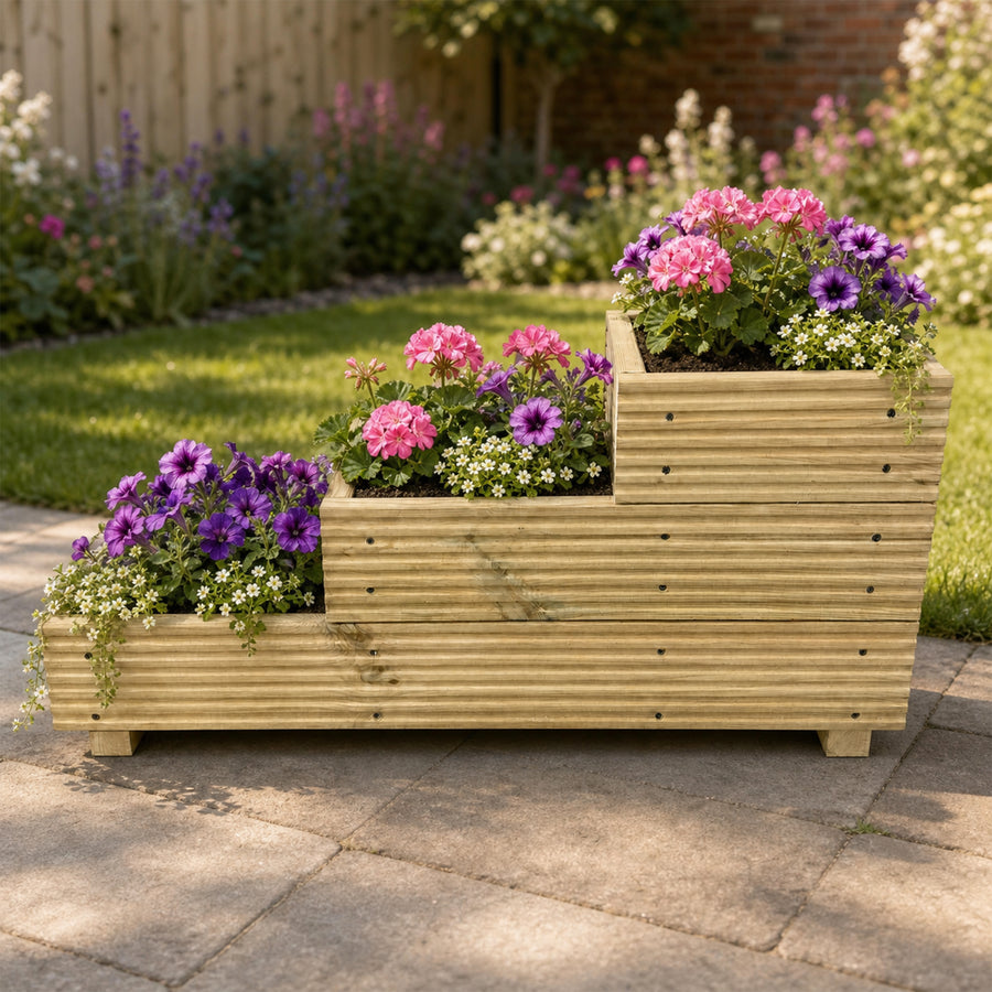 Three – Tier Wooden Decking Planter – 88 × 35 × 48 cm planted with colourful flowers