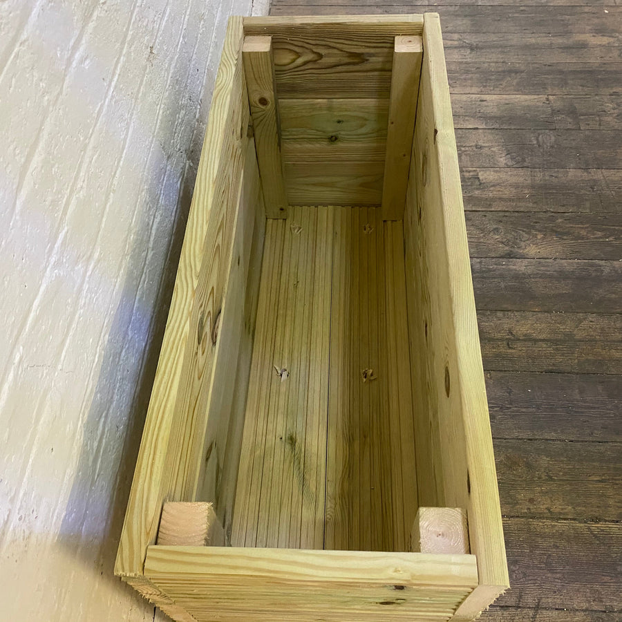 Pressure-treated wooden garden planter