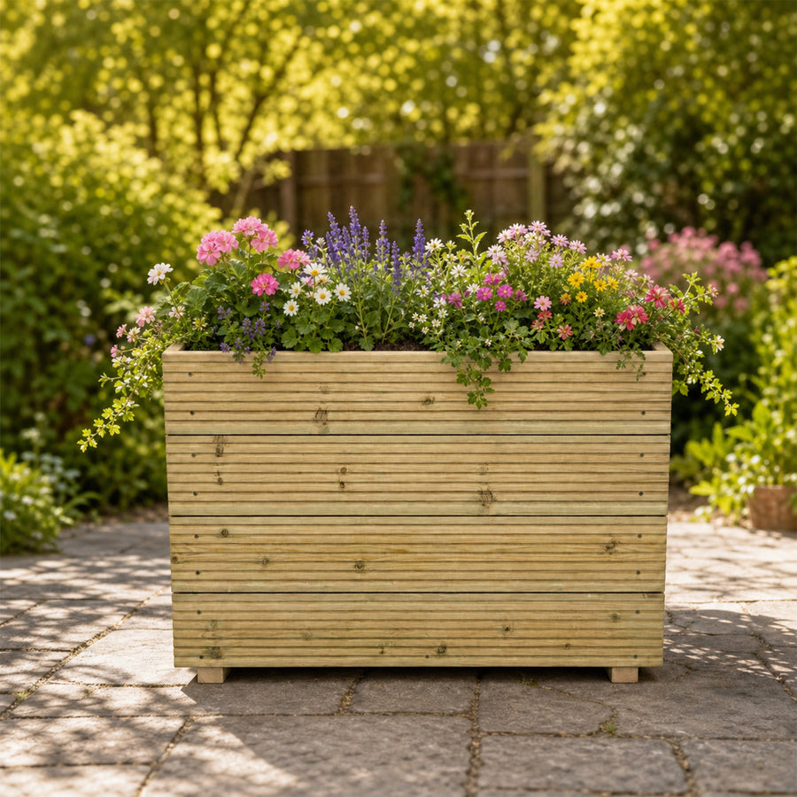 Tall Wooden Decking Planter – 88 × 35 × 63 cm planted with colourful flowers