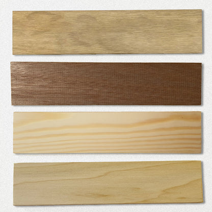 Four blank wooden plaque samples showing different wood colours and grain