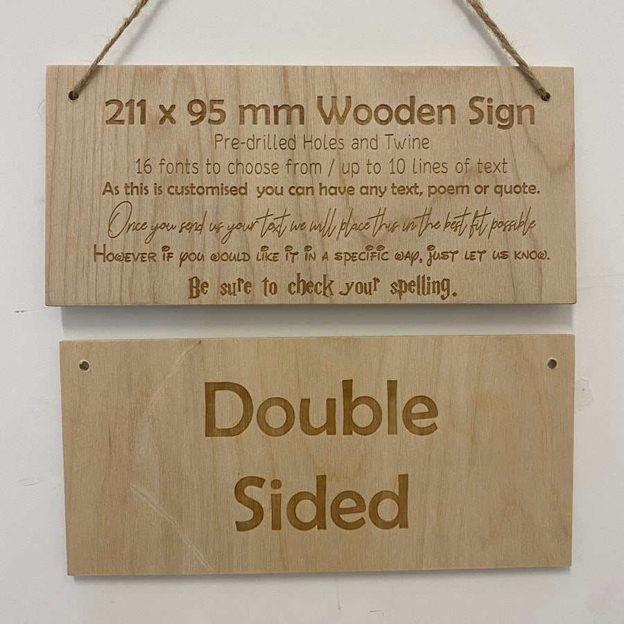 Front and reverse of a double-sided wooden sign with twine hanging cord