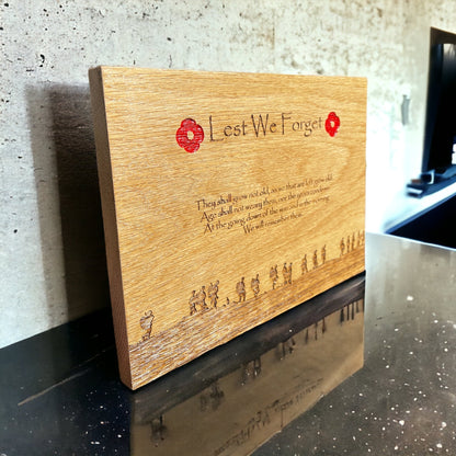 Oak remembrance plaque with red poppies and engraved soldier silhouettes