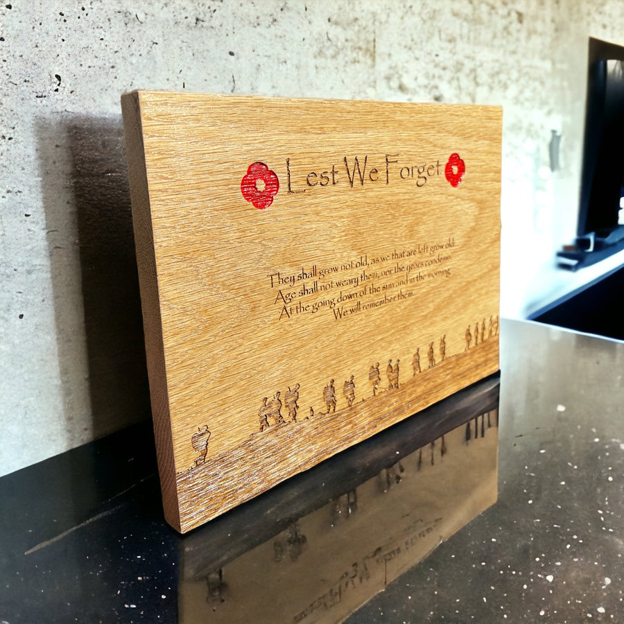 Oak remembrance plaque with red poppies and engraved soldier silhouettes