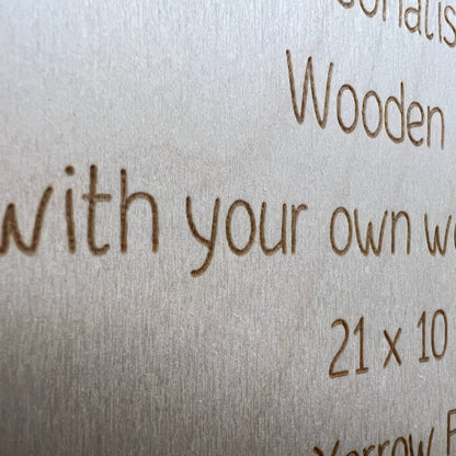 Close-up of engraved wording and natural grain on a wooden sign