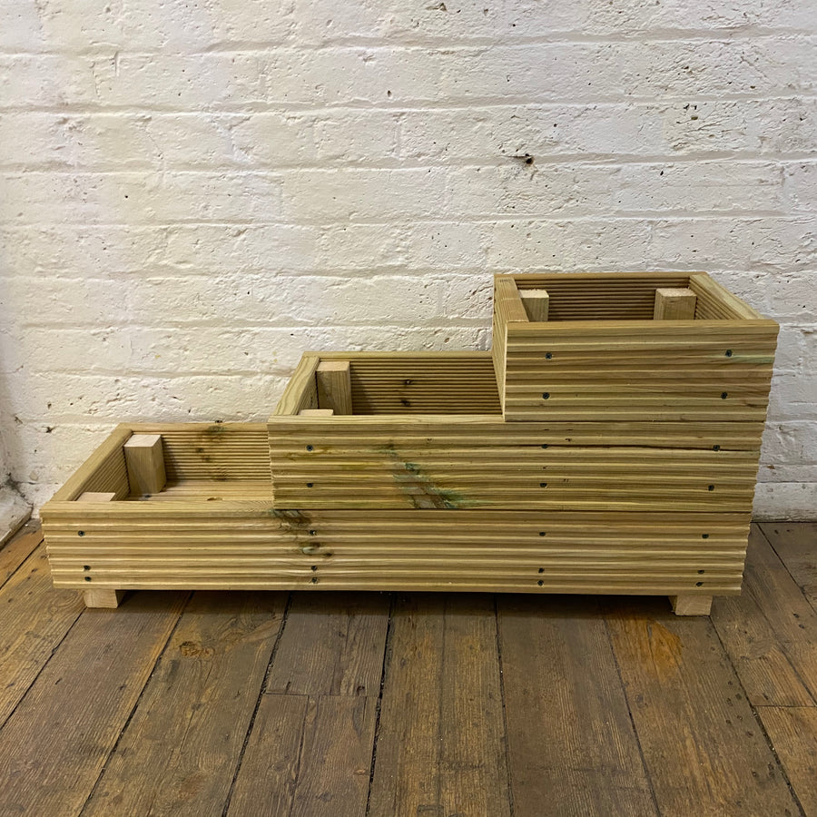 Pressure-treated wooden garden planter