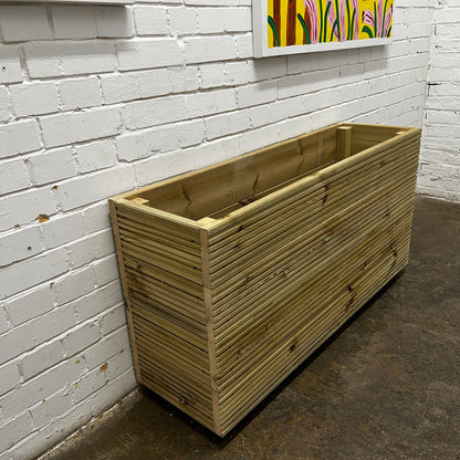 Handmade wooden decking planter with false bottom, 4ft long, 2ft tall, left side.