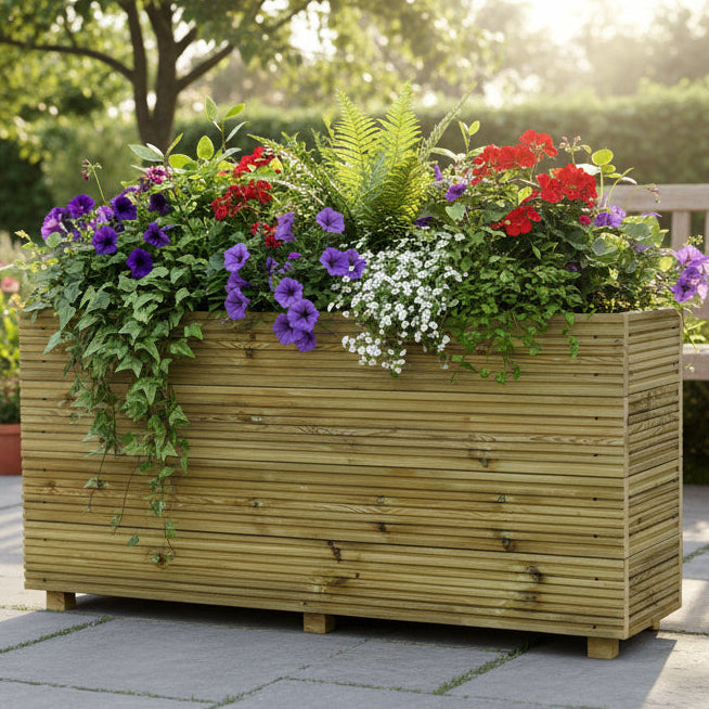 Wooden planter box with flowers in a garden setting